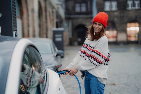 Lady charging an EV